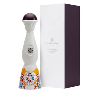 The Clase Azul Dia de Los Muertos 2022 Colores Limited Edition Tequila 1L features a tall, white ceramic bottle with colorful patterns and a matching gift box; enjoy its smooth vanilla and fresh agave notes.