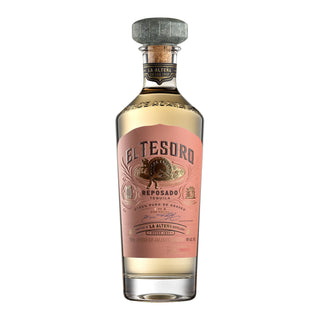 El Tesoro Reposado Tequila 750ml features a clear glass bottle with light gold tequila and a gray cap. Its pink and gold label showcases the brand, suggesting notes of cooked agave and toasted oak inside.