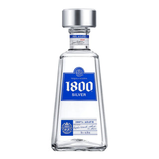 A clear 700ml bottle of 1800 Blanco Tequila with a silver cap and blue label displays "1800 Silver" and "100% Agave." Its rectangular, tapered design reflects crisp citrus notes and the pure essence of agave.