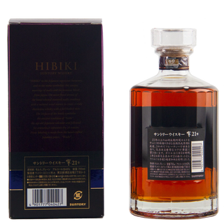 A bottle of Suntory Hibiki Scotch whisky with amber liquid and a black label, shown next to its dark navy and gold packaging box on a white background.