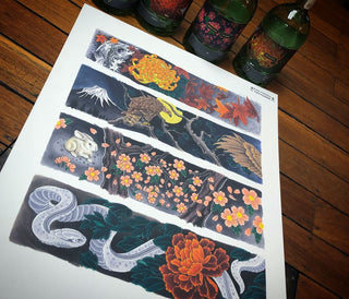 A sheet of four horizontal Japanese-style tattoo flash designs displayed on a wooden table, with decorative green bottles in the background.