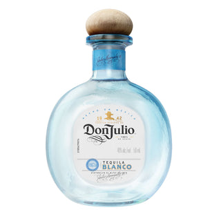 A clear 50ml bottle of Don Julio Blanco Tequila with a round wooden cap, blue-tinted glass, and a white label—crafted from premium blue agave with subtle citrus zest notes in every sip.