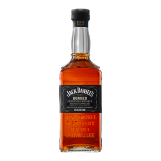 A bottle of Jack Daniel’s Bonded Tennessee Whiskey, boasting a black label with white text and embossed glass branding, contains amber whiskey with toasted oak and caramel notes.