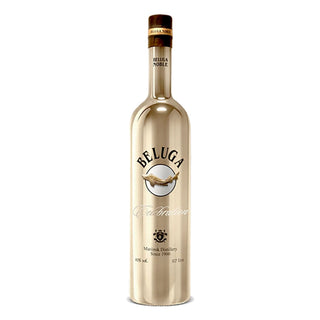 A tall, elegant 700ml bottle of Beluga Celebration Limited Edition Vodka features a metallic finish, gold accents, and a decorative Beluga fish logo, reflecting the smooth finish and subtle floral malt notes within.