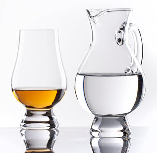 Crystal Glencairn water jug with handle for pouring a splash of water alongside whisky glasses
