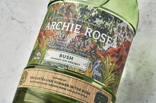 Bottle of Archie Rose Bush Summer Gin Project on a light gray background