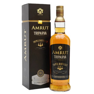 A bottle of Amrut Triparva Indian Single Malt whisky, with clear amber liquid and a gold cap, stands beside its black and gold “Triple Distilled” box—both highlighting the balanced sweetness from triple distillation.