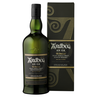 A bottle of Ardbeg An Oa Single Malt Scotch Whisky stands beside its matching black and gold box, both adorned with ornate designs and white and gold branding—known for its smoky character and subtle aniseed notes.
