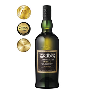 A dark green bottle of Ardbeg Corryvreckan Single Malt Scotch Whisky sits beside three gold award medallions, showcasing its acclaimed status and intense peat smoke character.