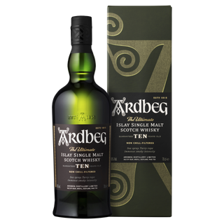 A bottle of Ardbeg 10 Year Old Single Malt Scotch Whisky stands beside its matching green and gold box, both displaying striking white and gold lettering with swirl designs that evoke the whisky's signature smoky peat essence.