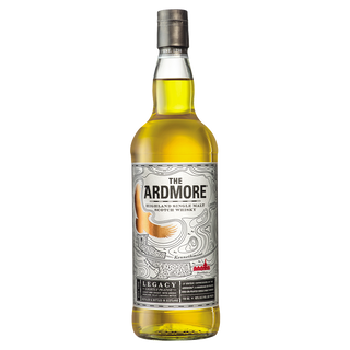 A bottle of Ardmore Legacy Single Malt Scotch Whisky with a silver label showing a golden eagle, black, gold, and red text on white, offering flavors of creamy vanilla and gentle peat smoke.