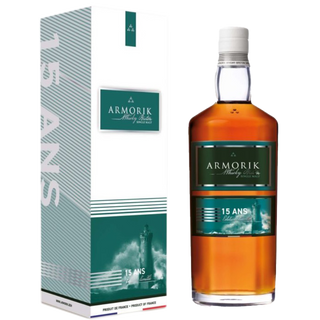 A bottle of Armorik 15 Ans French Single Malt Whisky, aged 15 years and renowned for its subtle peat and gentle smokiness, sits beside a box.