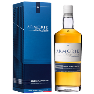 A bottle of Armorik Double Maturation French Single Malt Whisky stands beside its blue and white box, both featuring French product details. The golden whisky offers notes of vanilla, spice, and citrus on the palate.