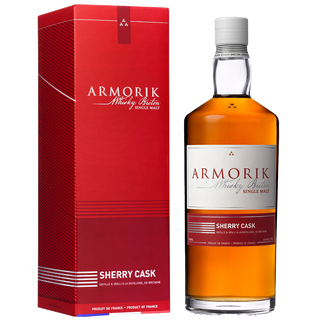 A bottle of Armorik Sherry Cask French Single Malt Whisky stands beside its red and white box, with both labels in French and English, suggesting flavors of roasted almonds and vanilla.