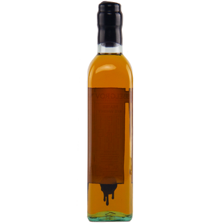 Bottle of amber liquid with a black cap on a white background