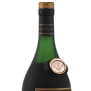 Green wine bottle with gold cap and label on a white background