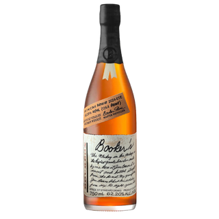 A bottle of Booker’s 2024 Bourbon with a wax-sealed black cap, handwritten-style labels displaying batch and proof info, showcases amber whiskey visible through clear glass, hinting at flavors of caramel and charred oak.