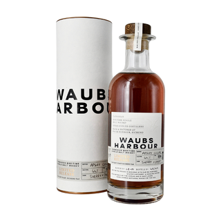 A bottle of Waubs Harbour Great Southern Reef Tasmanian Single Malt Whisky with a white cylindrical case, both featuring black and gold text. The label notes cask type, batch, and flavors of fruit aromas with salted caramel fudge on the palate.