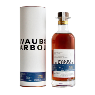 A bottle of Waubs Harbour Port Storm Tasmanian Single Malt Whisky stands beside its cylindrical white packaging, both with blue and black text. The amber whisky offers notes of toasted oak and ripe cherries.