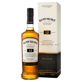A bottle of Bowmore 12 Year Old Single Malt Scotch Whisky stands beside its box, both with cream and black labels accented in gold and orange. The amber whisky inside offers notes of peat smoke and honeyed sweetness.
