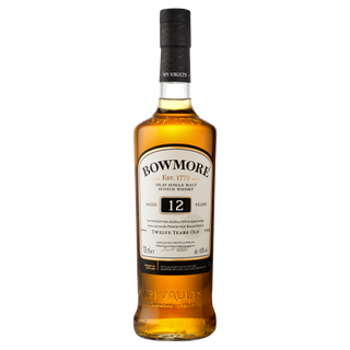 A bottle of Bowmore 12 Year Old Single Malt Scotch Whisky, featuring a black cap, amber liquid, and white label with brand and age statement, celebrated for its honeyed sweetness and gentle coastal brine.