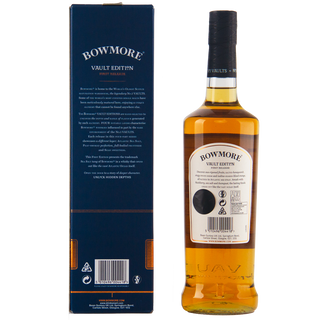 A bottle of Bowmore Vault Edition Atlantic Sea Salt (First Release) single malt Scotch whisky stands beside its dark blue box, both featuring the brand name and product details in white text, evoking hints of sea breeze and spiced cocoa.