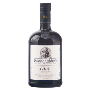 A bottle of Bunnahabhain The Coterie Exclusive single malt Scotch whisky on a plain white background.