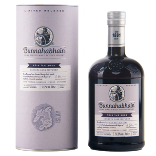 A bottle of Bunnahabhain Perth Ile 2023 single malt Scotch whisky next to its matching cylindrical packaging box, both in a clean studio setting.
