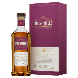 A 700ml bottle of Bushmills 16 Year Old Single Malt Irish Whiskey stands beside its maroon and gold box, with a label highlighting its age, rarity, and rich notes of dried figs and dark chocolate.