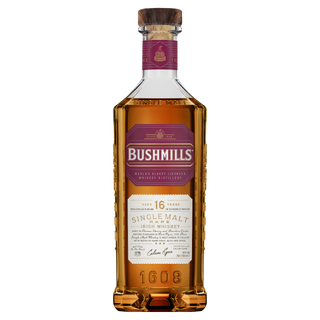 Bushmills 16 Year Old Single Malt Irish Whiskey features a wooden cap, branded label with age and details, and amber liquid offering notes of dark chocolate and caramelised nuts.