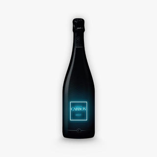 Champagne Carbon Luminous features a dark bottle with a sleek black carbon fiber texture and a glowing blue CARBON BRUT label, hinting at fine bubbles and green apple notes, set against a plain white background.