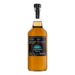 A 700ml bottle of Casamigos Anejo Tequila features a black label on clear glass with amber liquid, product details, signatures, a blue agave graphic, and notes of sweet oak and caramel from roasted agave.