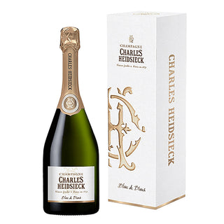 A bottle of Charles Heidsieck Blanc de Blancs NV with fine bubbles stands next to its box, promising a delightful experience.