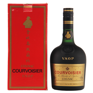 Courvoisier VSOP cognac bottle and red box on a white background