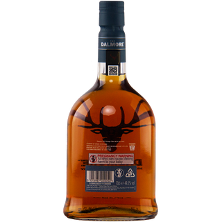 The back of The Dalmore 18 Year Old 2005 Vintage Single Malt Whisky shows amber liquid, a stag emblem, barcode, red pregnancy warning label, and a QR code on the neck. The black cap hints at notes of dark chocolate and spiced fruitcake.