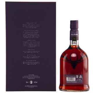 A bottle of The Dalmore 30 Year Old Single Malt Scotch Whisky with a dark label and stag logo stands beside its matching box, featuring white text and suggesting flavors of Black Forest gateau and rich dark chocolate.
