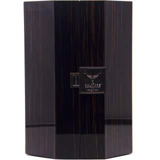 A tall, dark, hexagonal wooden box with a glossy finish and a central metal plaque featuring an antler design and text holds The Dalmore 40 Year Old Single Malt Scotch Whisky, displayed closed against a plain background—ideal for gifting.