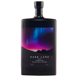 A dark bottle of Dark Lark 2024 Single Malt Whisky sports a vivid aurora label over mountain silhouettes, suggesting rich blackcurrant crumble and mocha notes inside.