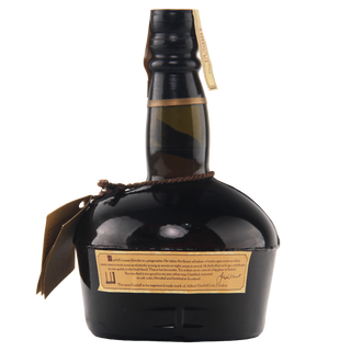 Whiskey bottle with a label on a white background