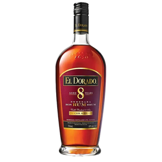 A 750ml bottle of El Dorado 8 Years Denmara Ron Rum Rhin cask aged rum, featuring amber-brown liquid inside a clear glass bottle with a black and gold label.