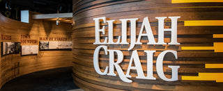 Wooden wall with 'Elijah Craig' branding in a museum setting