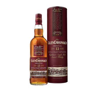 A bottle of Glendronach 12 Year Old Single Malt Scotch Whisky stands beside its matching maroon cylindrical box, both with gold and white labels, hinting at flavors of creamy vanilla and dark chocolate.