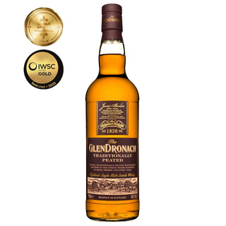 A bottle of Glendronach Traditionally Peated Single Malt Scotch Whisky with a dark label is shown, featuring two gold award medals on the left. It highlights rich sherry notes and subtle hints of peat smoke.