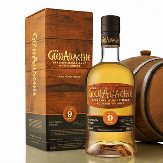 A bottle of GlenAllachie 9 Year Old Rye Cask Finish Single Malt Scotch Whisky stands beside its box and a wooden barrel, featuring golden hues with notes of honeyed spices and candied orange on the label.