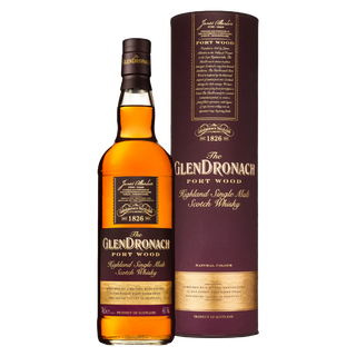 A bottle of Glendronach Port Wood Single Malt Scotch Whisky stands beside its matching cylindrical box, both adorned with dark purple and gold labels that evoke the port wine and ripe berry notes found in each sip.