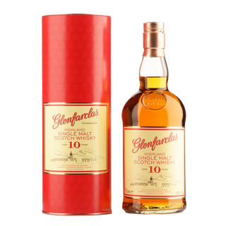 A bottle of Glenfarclas 10 Year Old Single Malt Scotch Whisky stands beside its matching red cylindrical packaging, both labeled in cream and red, offering inviting notes of sherry-sweet malt and hints of dried fruit.