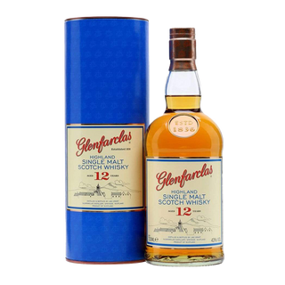 A bottle of Glenfarclas 12 Year Old Single Malt Scotch Whisky stands beside its blue cylindrical box, both with cream and red labels featuring gold accents—a renowned sherried malt known for its rich character.