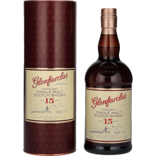 A bottle of Glenfarclas 15 Year Old Single Malt Scotch Whisky in cylindrical packaging; its cream label with red and gold text and a distillery sketch reflects the full-bodied, sherried character of this Highland single malt.