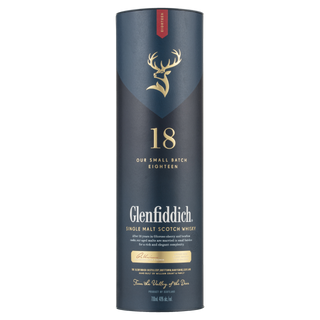 A tall, cylindrical box of Glenfiddich 18 Year Old Single Malt Scotch Whisky features a gold deer logo, gold and white text, and a dark blue design highlighting dried fruit and rich oak notes with batch details.
