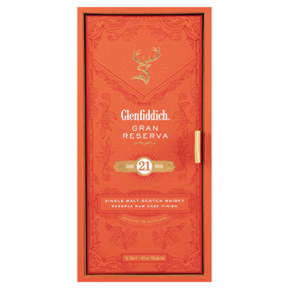A rectangular orange box with gold accents for Glenfiddich 21 Year Old Gran Reserva Single Malt Scotch Whisky, featuring a stag logo and highlighting its rum cask finish with notes of toffee and tropical fruit.